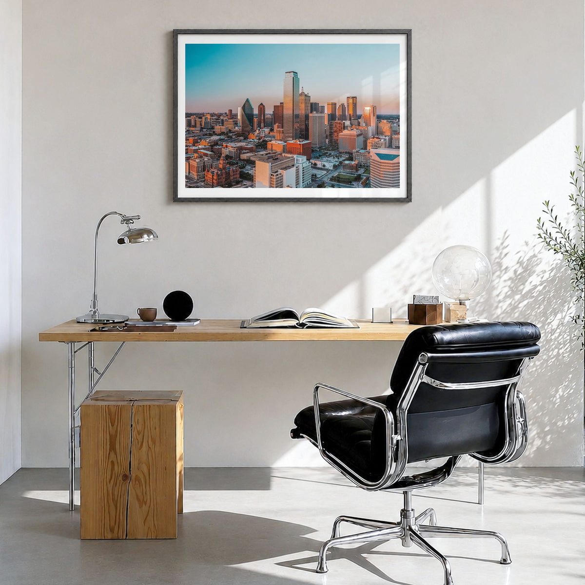 Dallas Photo Poster in a black wood frame, hanging in a bright home office, white border