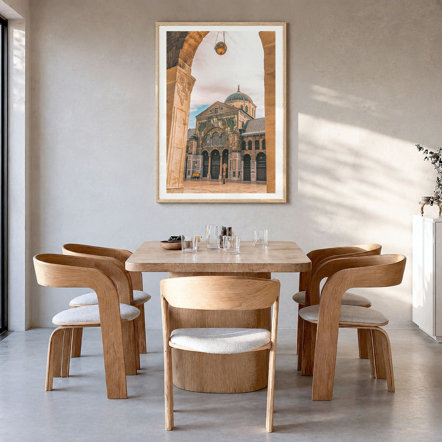 Damascus Photo Poster in a natural wood frame, hanging in a dining room, white border