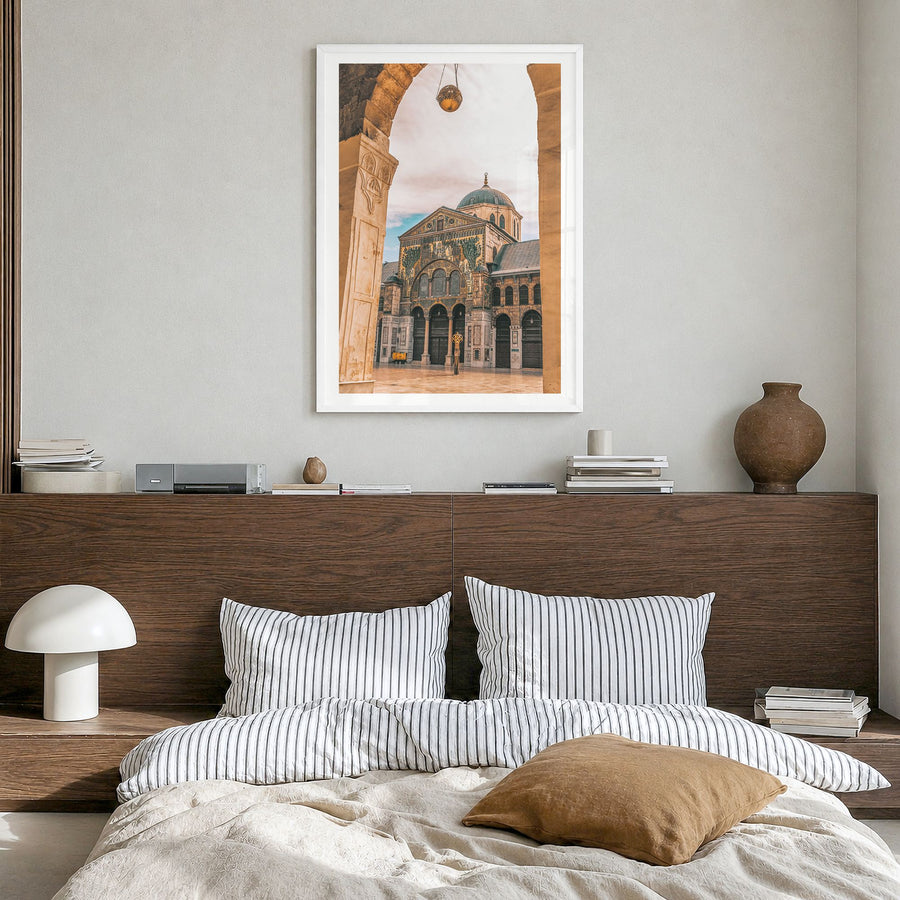 Damascus Photo Poster in a white wood frame, hanging in a bedroom, white border