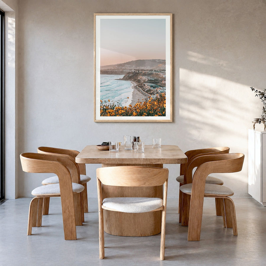 Dana Point Photo No 1 Poster in a natural wood frame, hanging in a dining room, white border