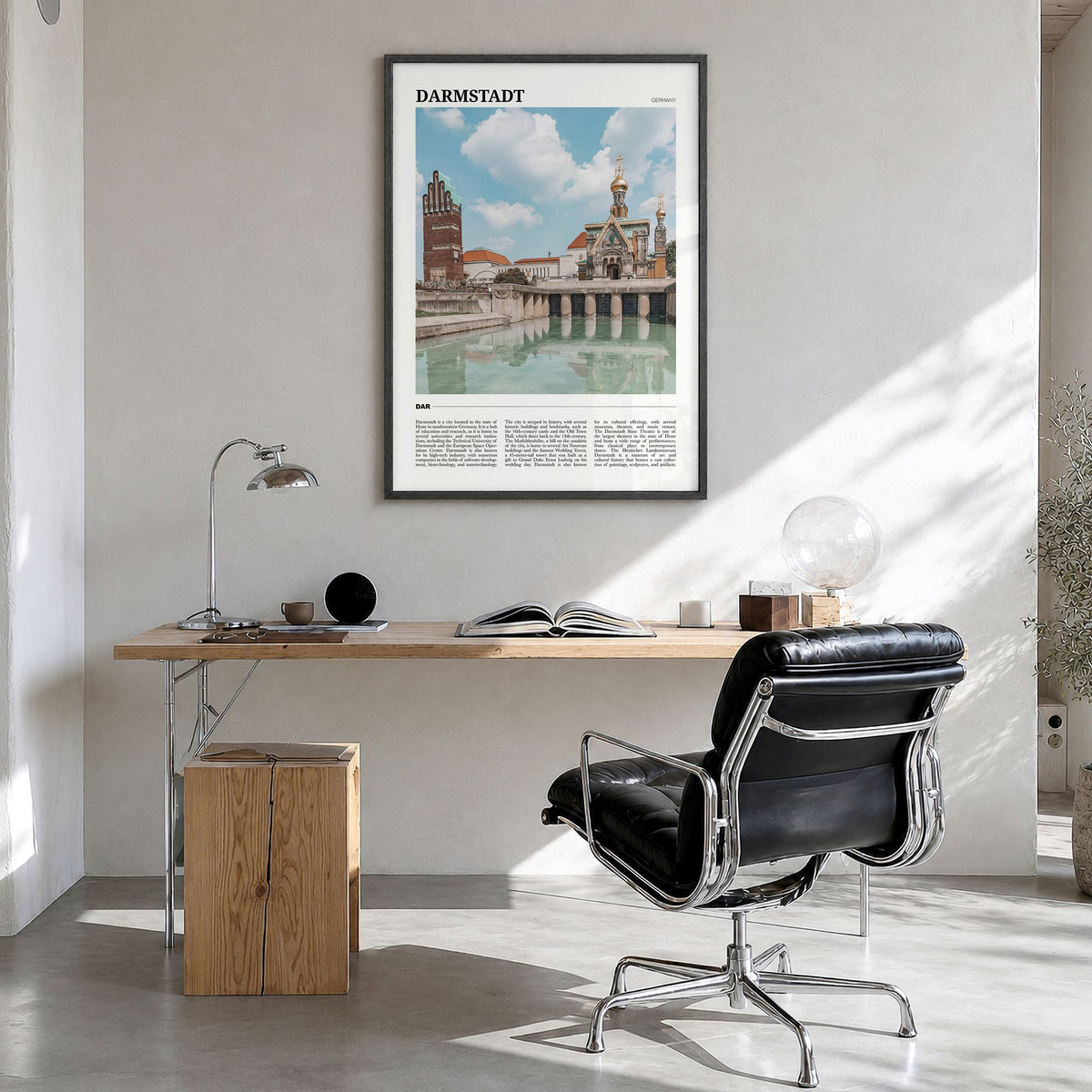 Darmstadt Travel Poster in a black wood frame, hanging in a bright home office