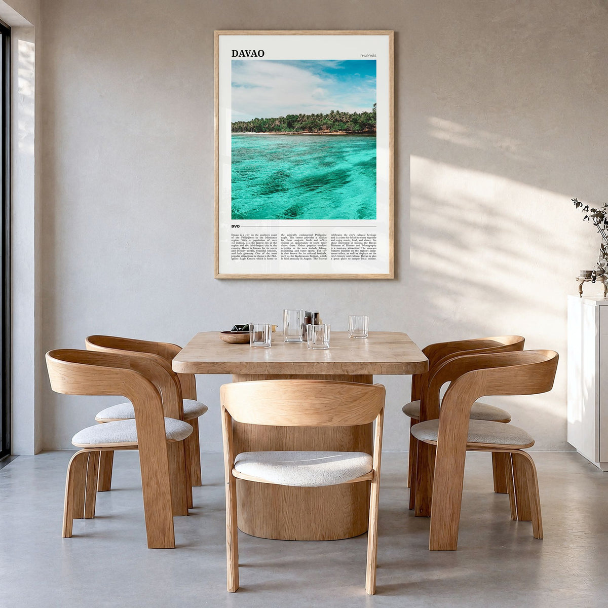 Davao Travel Poster in a natural wood frame, hanging in a dining room