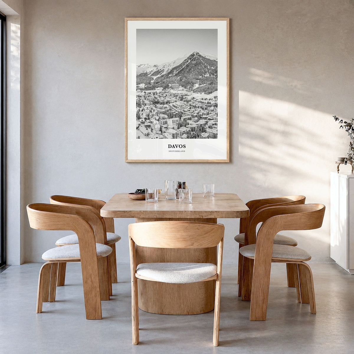 Davos Classic Poster in a natural wood frame, hanging in a dining room