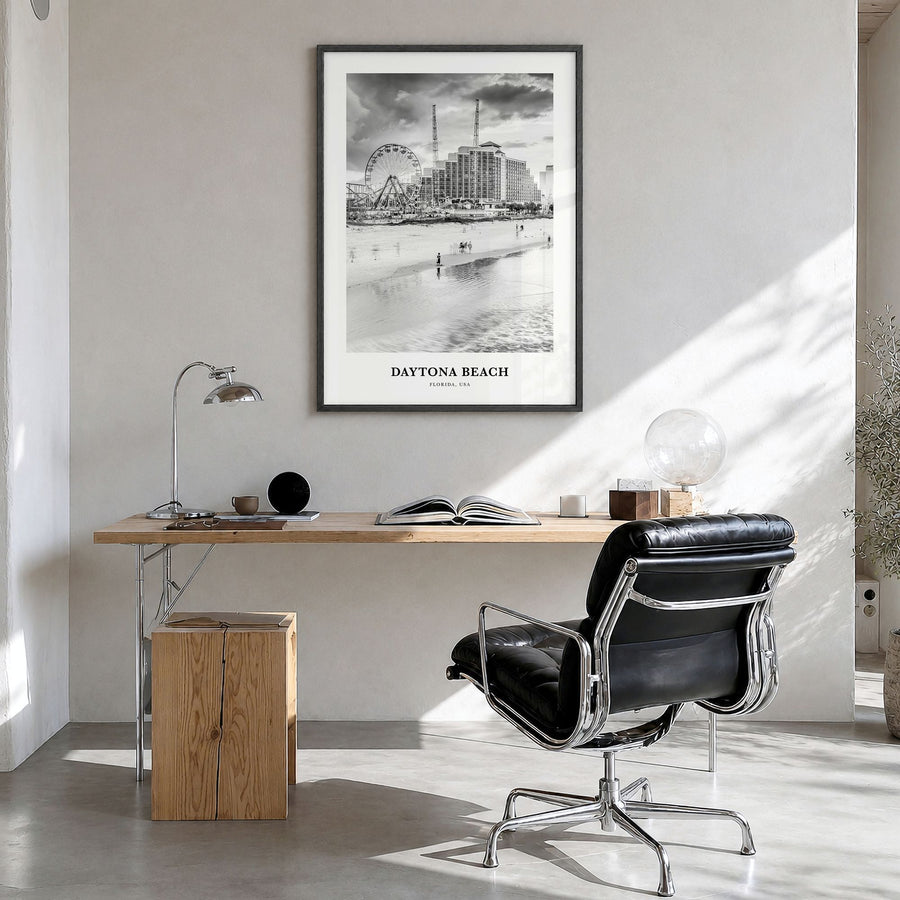 Daytona Beach Classic Poster in a black wood frame, hanging in a bright home office