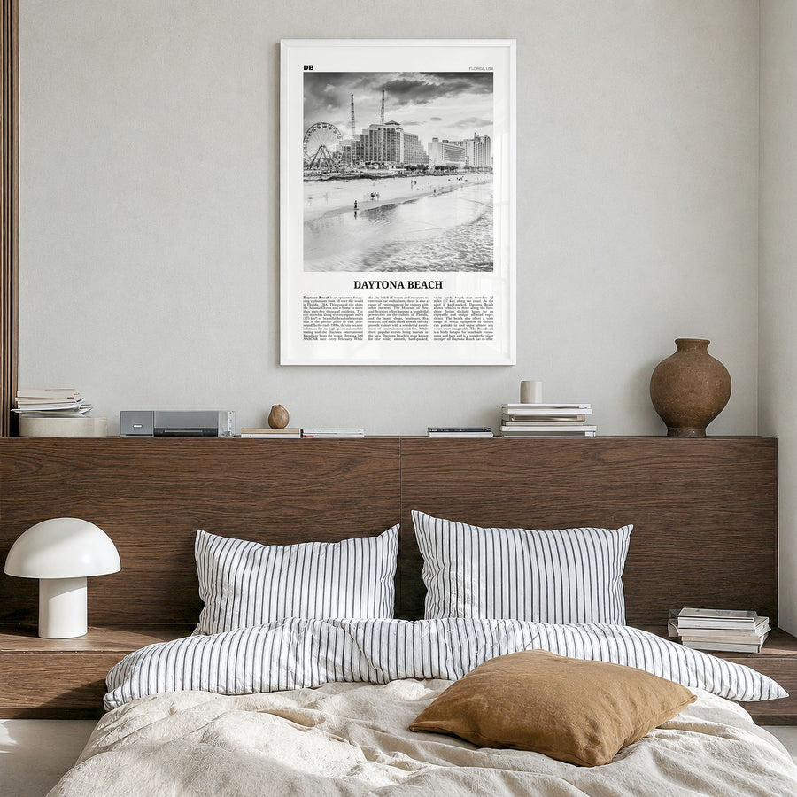 Daytona Beach Newspaper Poster in a white wood frame, hanging in a bedroom