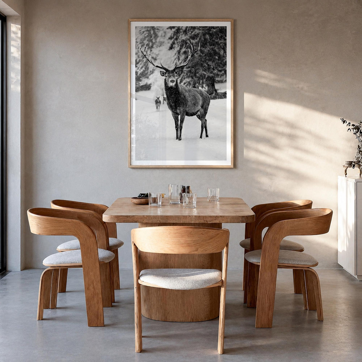 Deer black & white photo poster – vertical wall art in natural wood frame with white border, hanging on wall