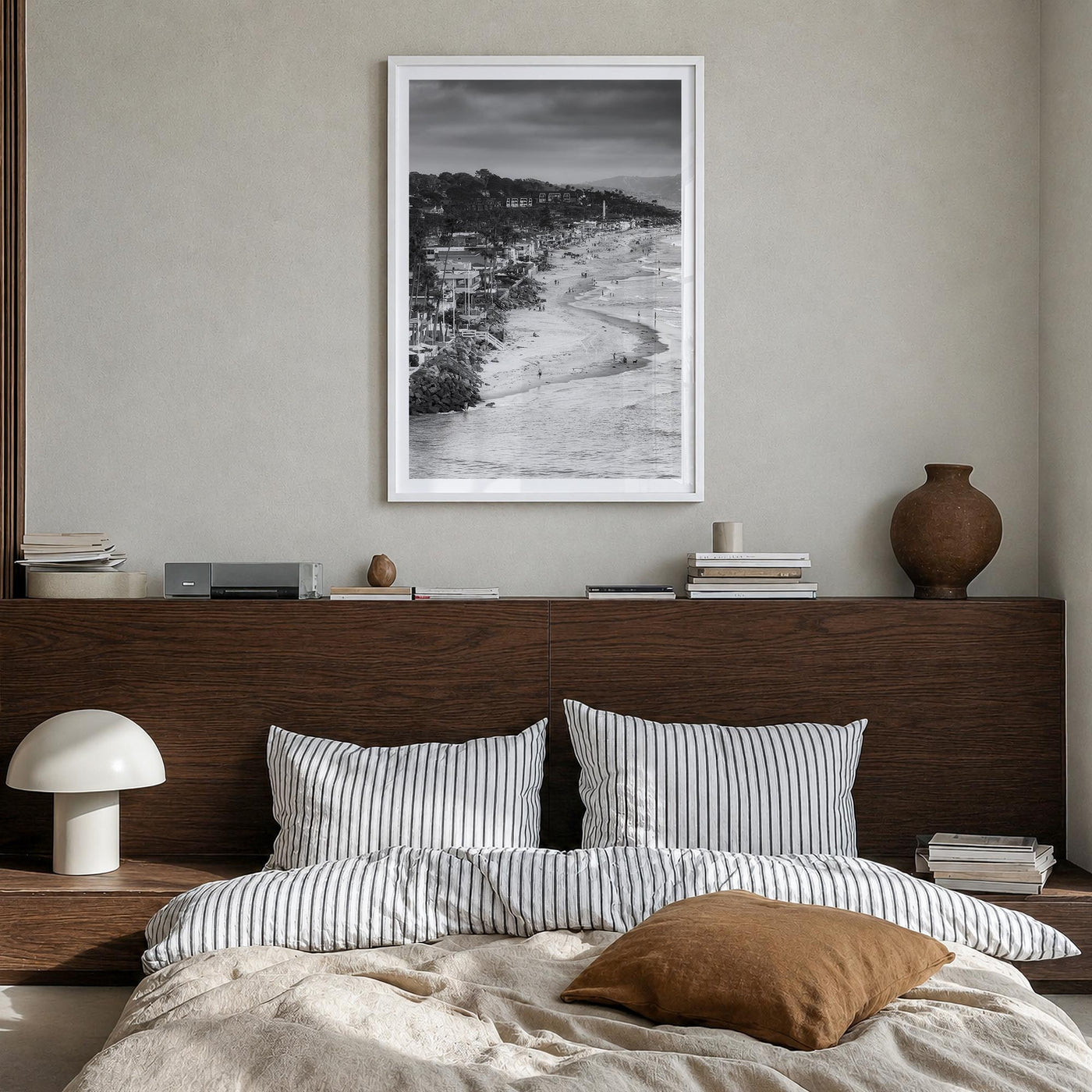 Del Mar black & white photo poster of California, USA – vertical wall art in white wood frame with white border, hanging on w