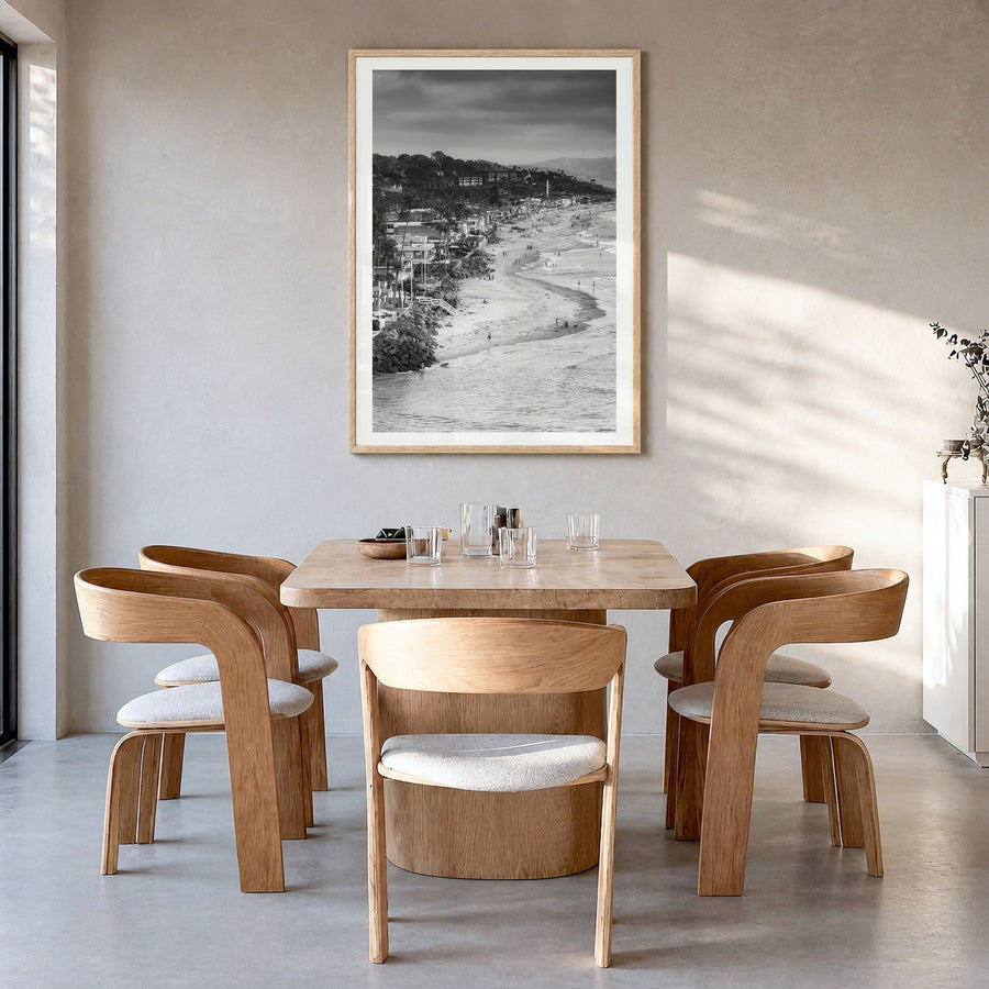 Del Mar Photo Poster in a natural wood frame, hanging in a dining room, white border
