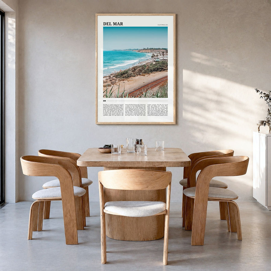Del Mar Travel Poster in a natural wood frame, hanging in a dining room