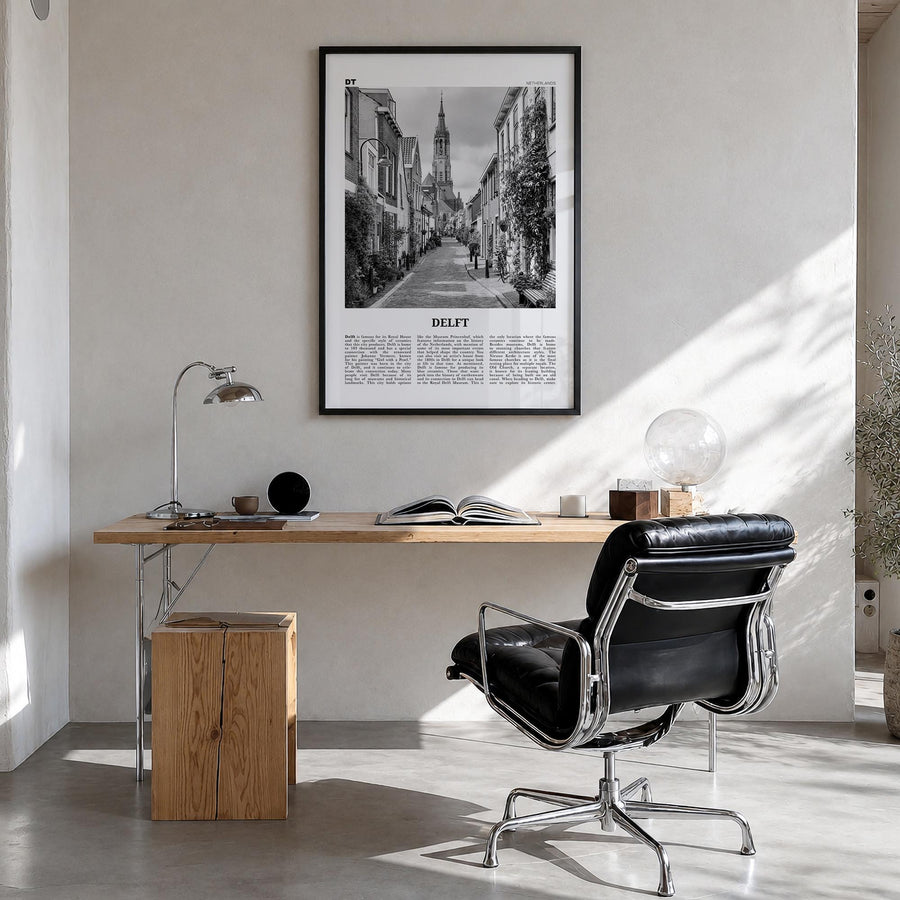 Delft black & white newspaper poster of Netherlands – vertical wall art in black wood frame, hanging on wall