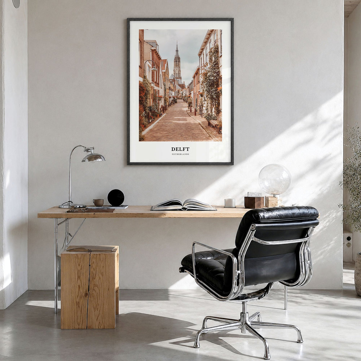 Delft Classic Poster in a black wood frame, hanging in a bright home office
