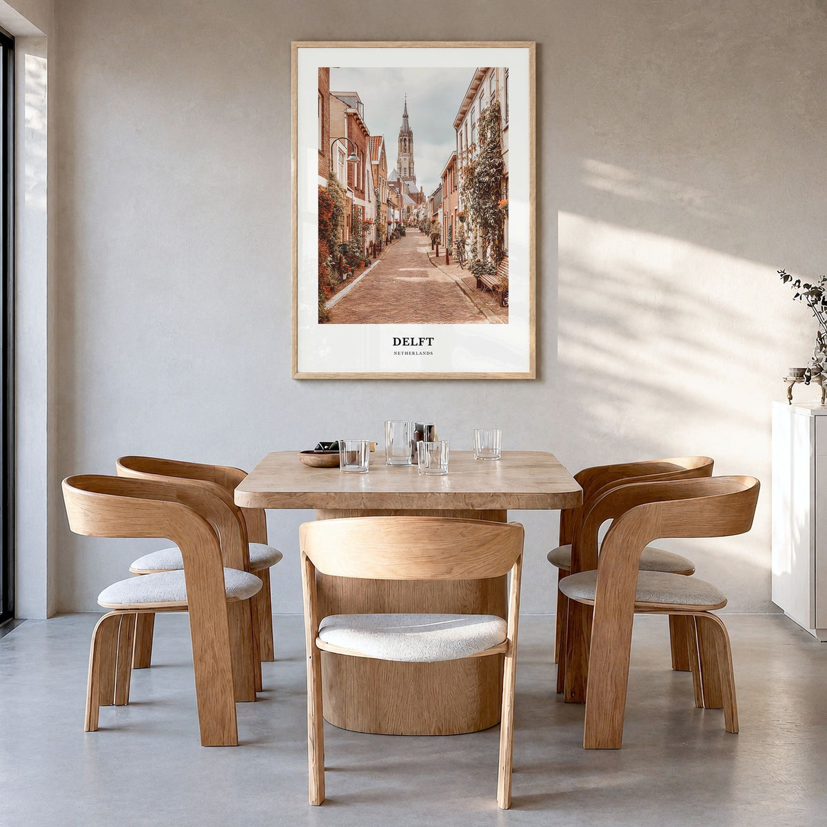 Delft Classic Poster in a natural wood frame, hanging in a dining room