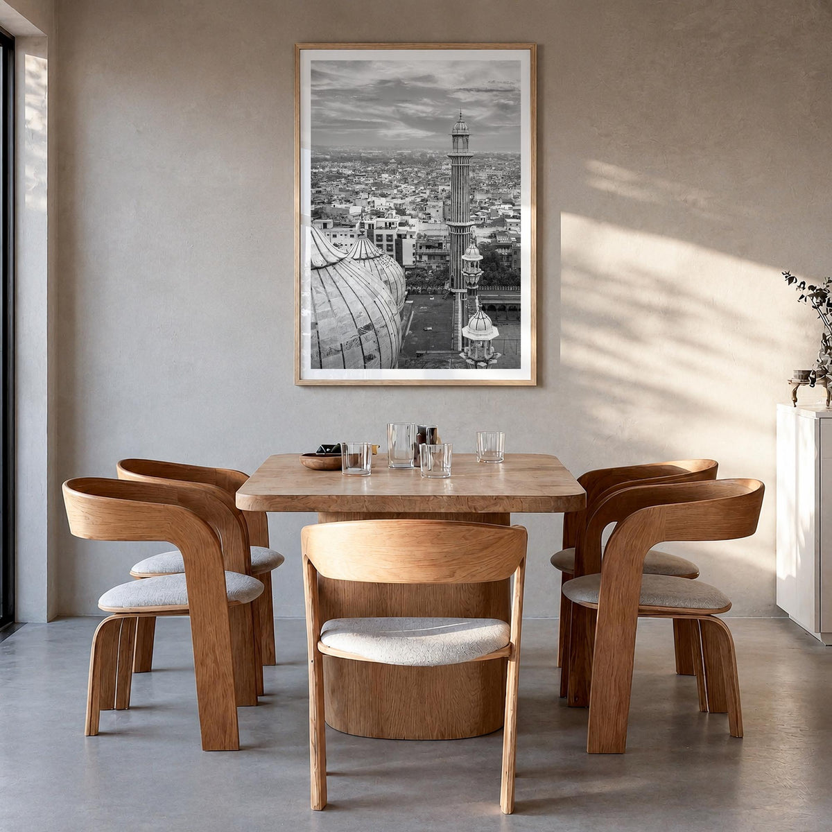 Delhi black & white photo poster of India – vertical wall art in natural wood frame with white border, hanging on wall