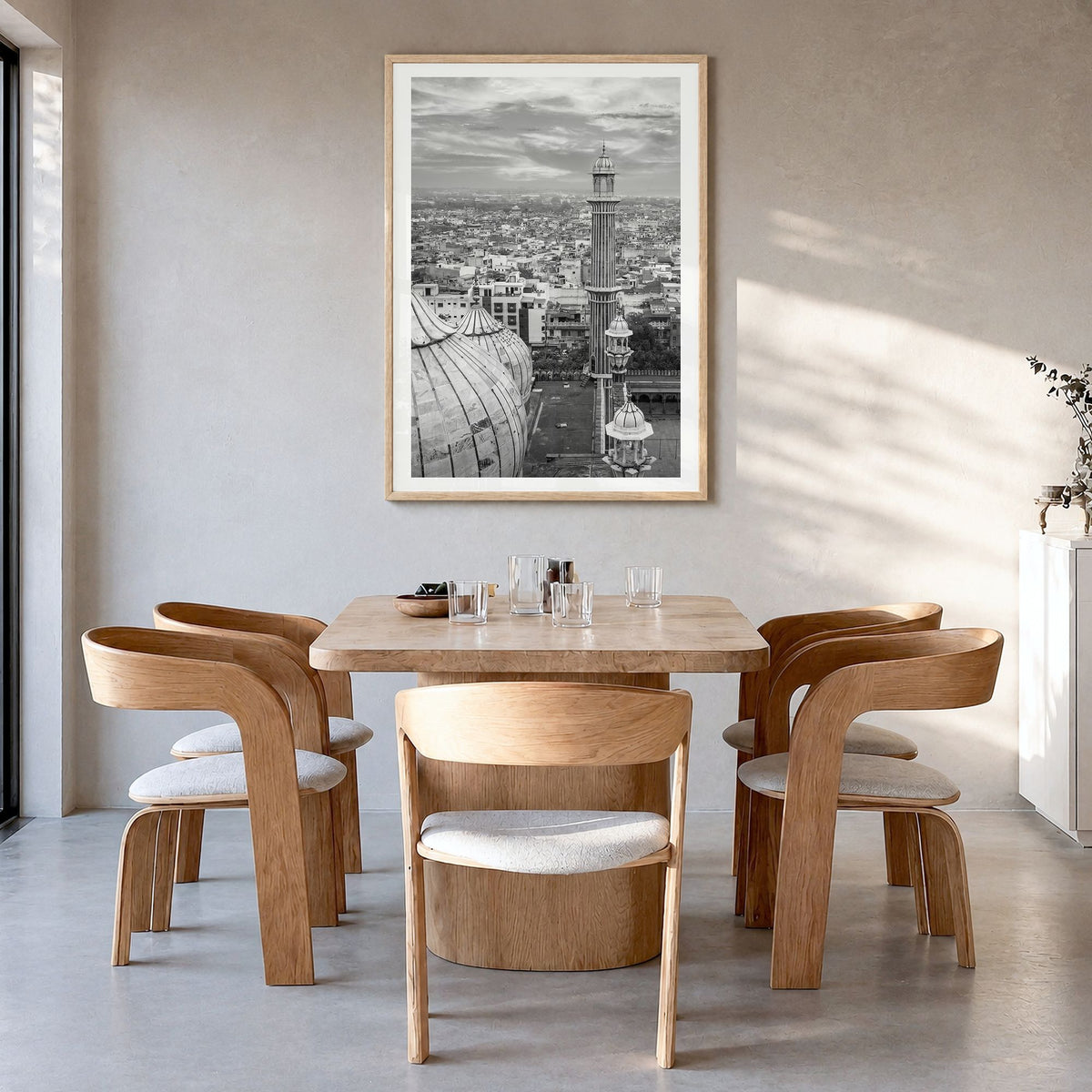 Delhi Photo Poster in a natural wood frame, hanging in a dining room, white border