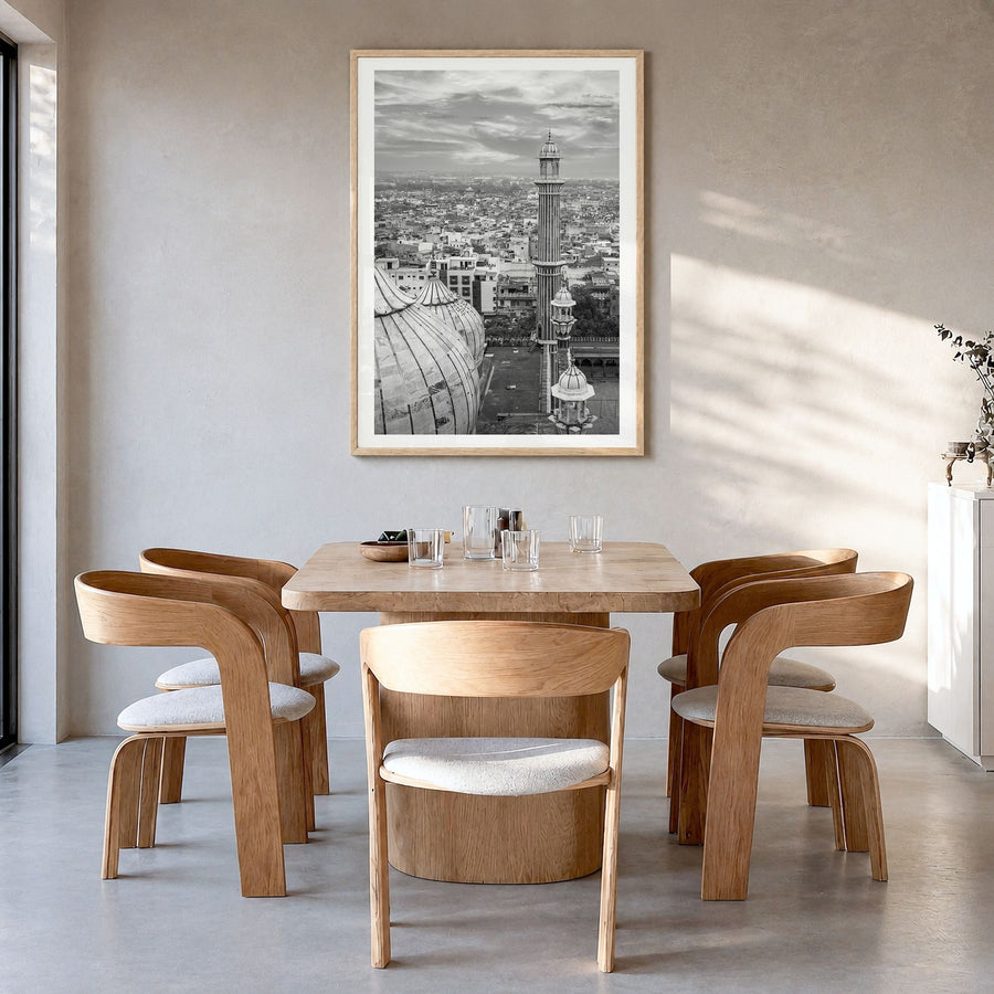 Delhi Photo Poster in a natural wood frame, hanging in a dining room, white border