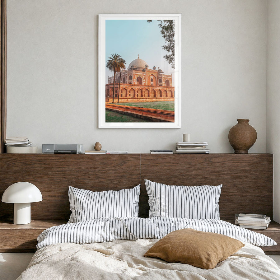 Delhi Photo Poster in a white wood frame, hanging in a bedroom, white border