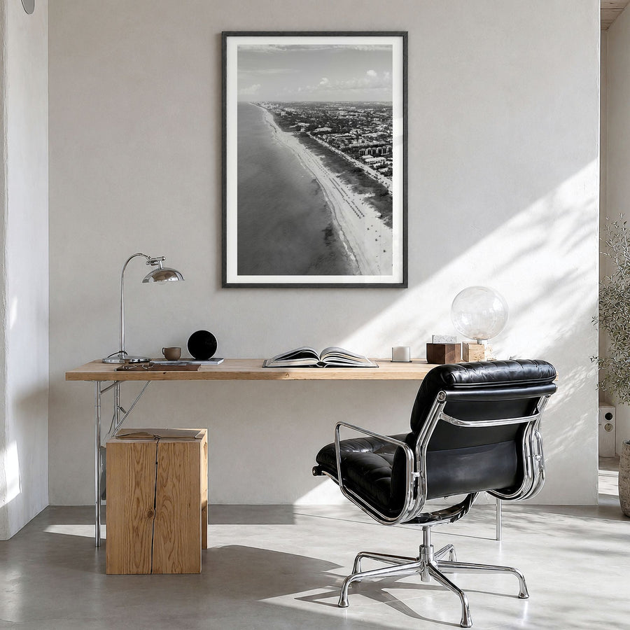 Delray Beach Photo Poster in a black wood frame, hanging in a bright home office, white border