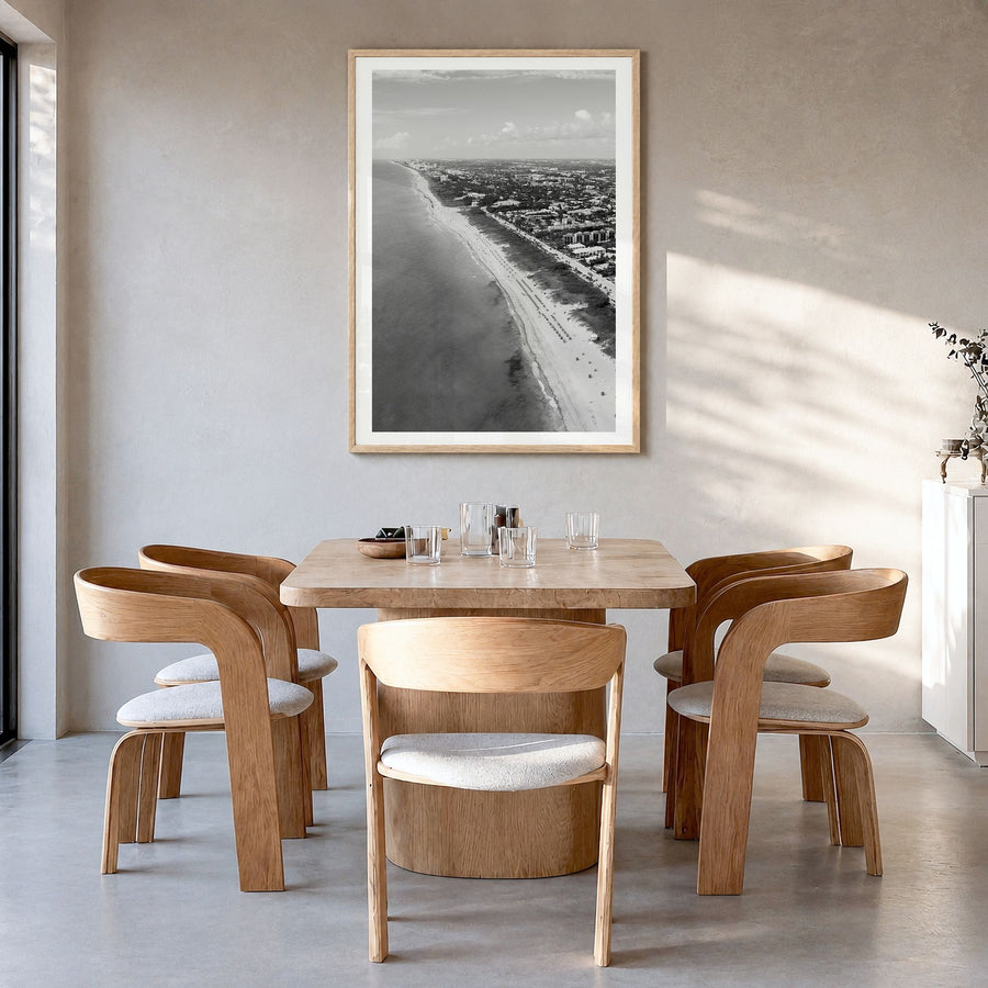 Delray Beach Photo Poster in a natural wood frame, hanging in a dining room, white border