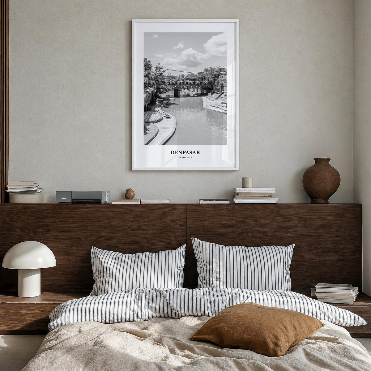 Denpasar black & white classic poster of Indonesia – vertical wall art in white wood frame, hanging on wall