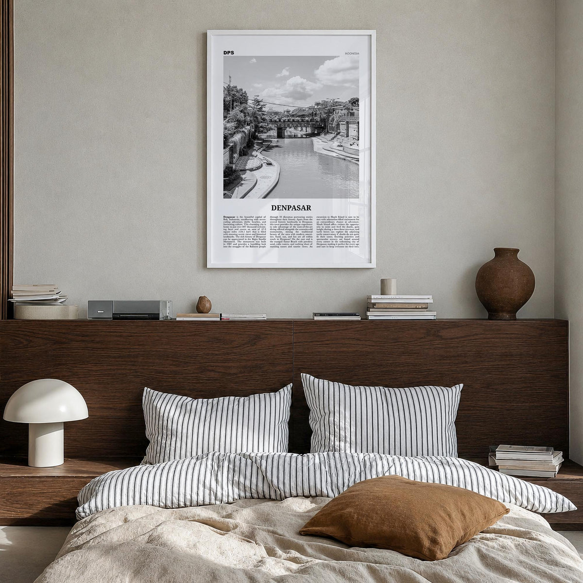 Denpasar black & white newspaper poster of Indonesia – vertical wall art in white wood frame, hanging on wall