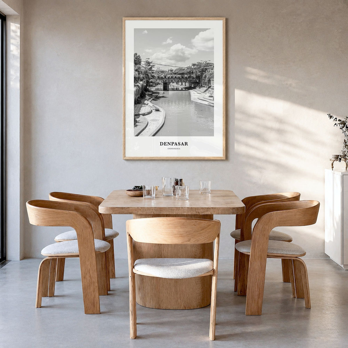 Denpasar Classic Poster in a natural wood frame, hanging in a dining room