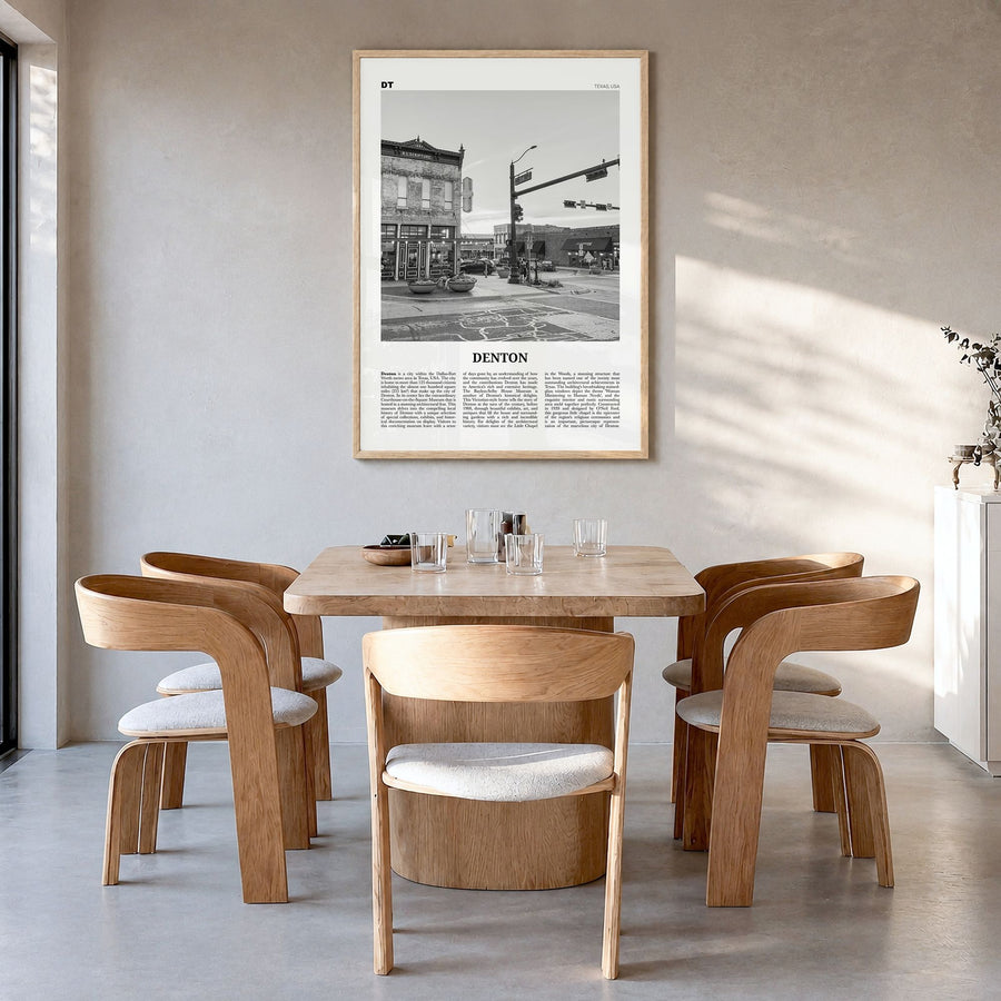 Denton Newspaper Poster in a natural wood frame, hanging in a dining room