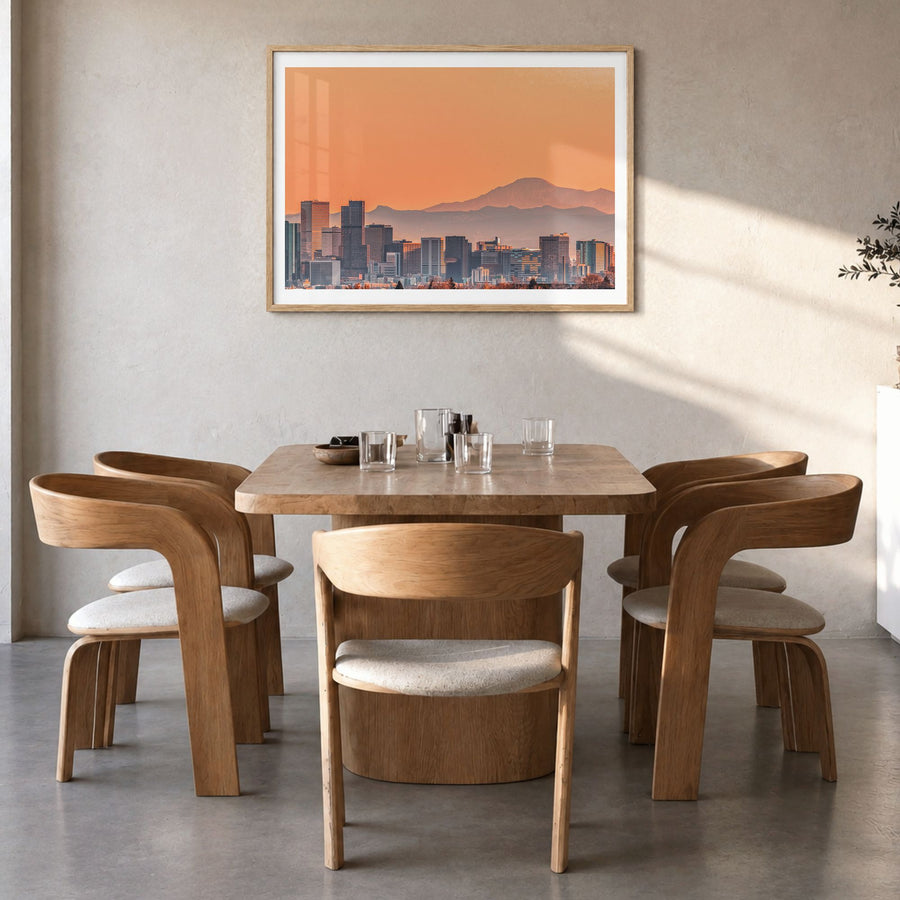 Denver Photo Poster in a natural wood frame, hanging in a dining room, white border