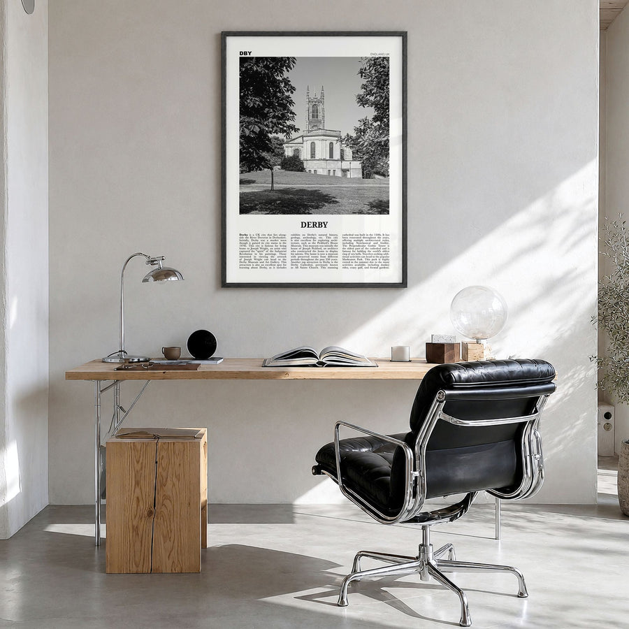 Derby Newspaper Poster in a black wood frame, hanging in a bright home office