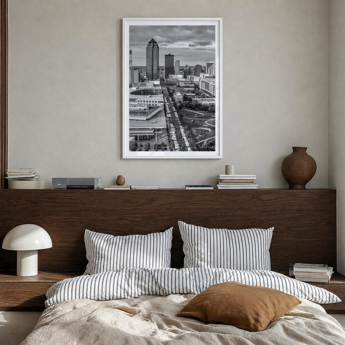 Des Moines black & white photo poster of Iowa, USA – vertical wall art in white wood frame with white border, hanging on wall