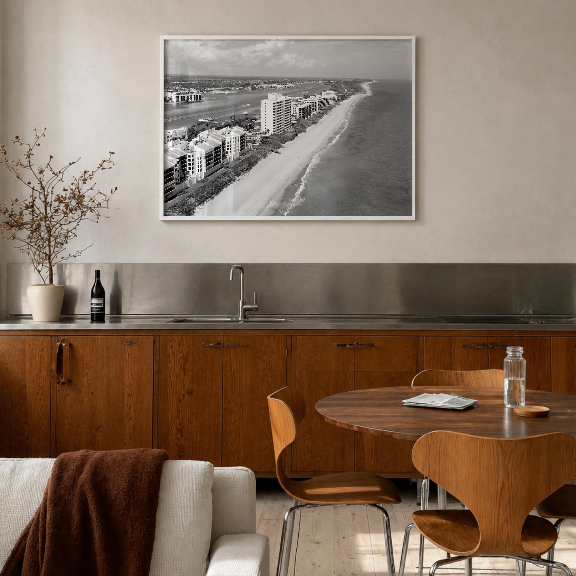 Destin black & white photo poster of Florida, USA – horizontal wall art in white wood frame, hanging on wall