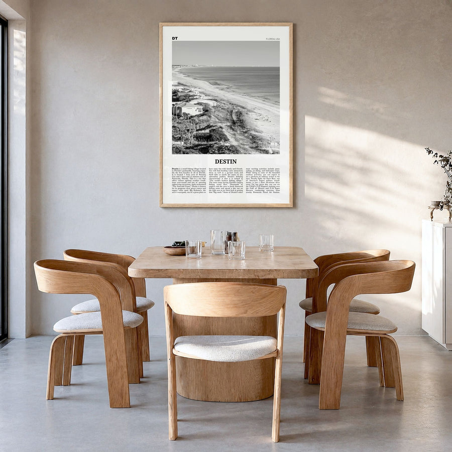 Destin Newspaper No 1 Poster in a natural wood frame, hanging in a dining room