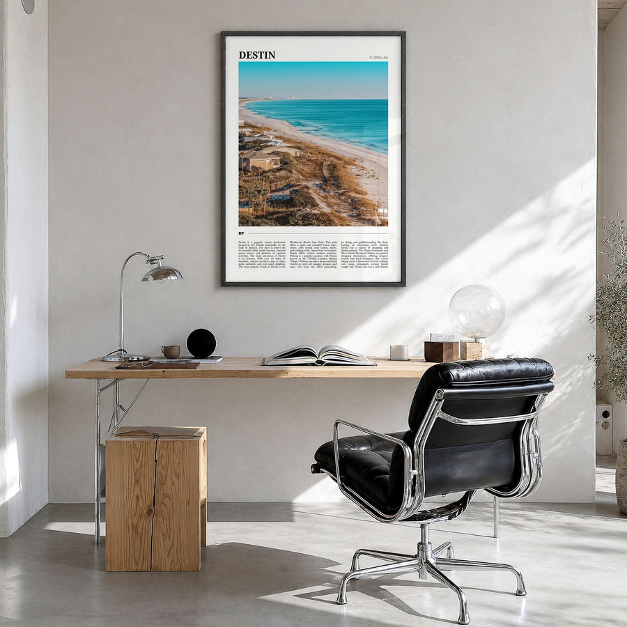 Destin Travel Poster in a black wood frame, hanging in a bright home office