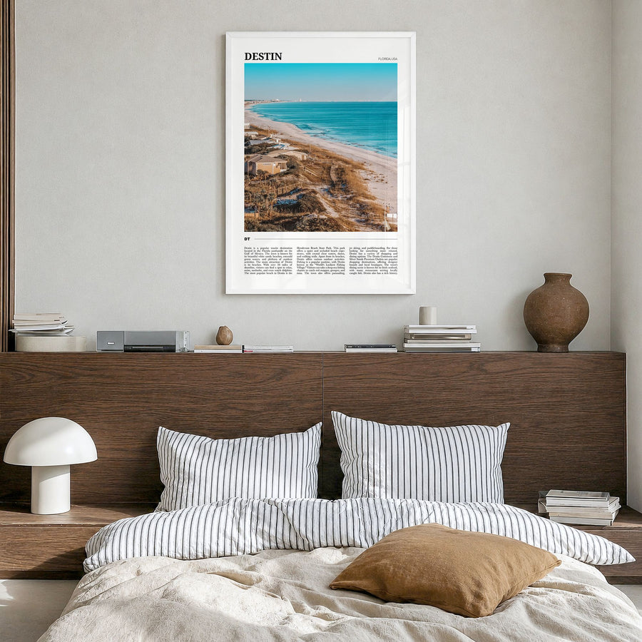 Destin Travel Poster in a white wood frame, hanging in a bedroom
