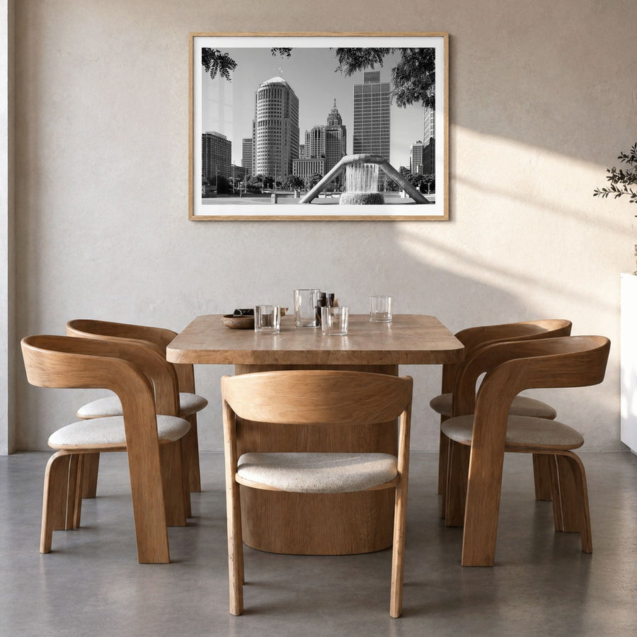 Detroit Photo Poster in a natural wood frame, hanging in a dining room, white border