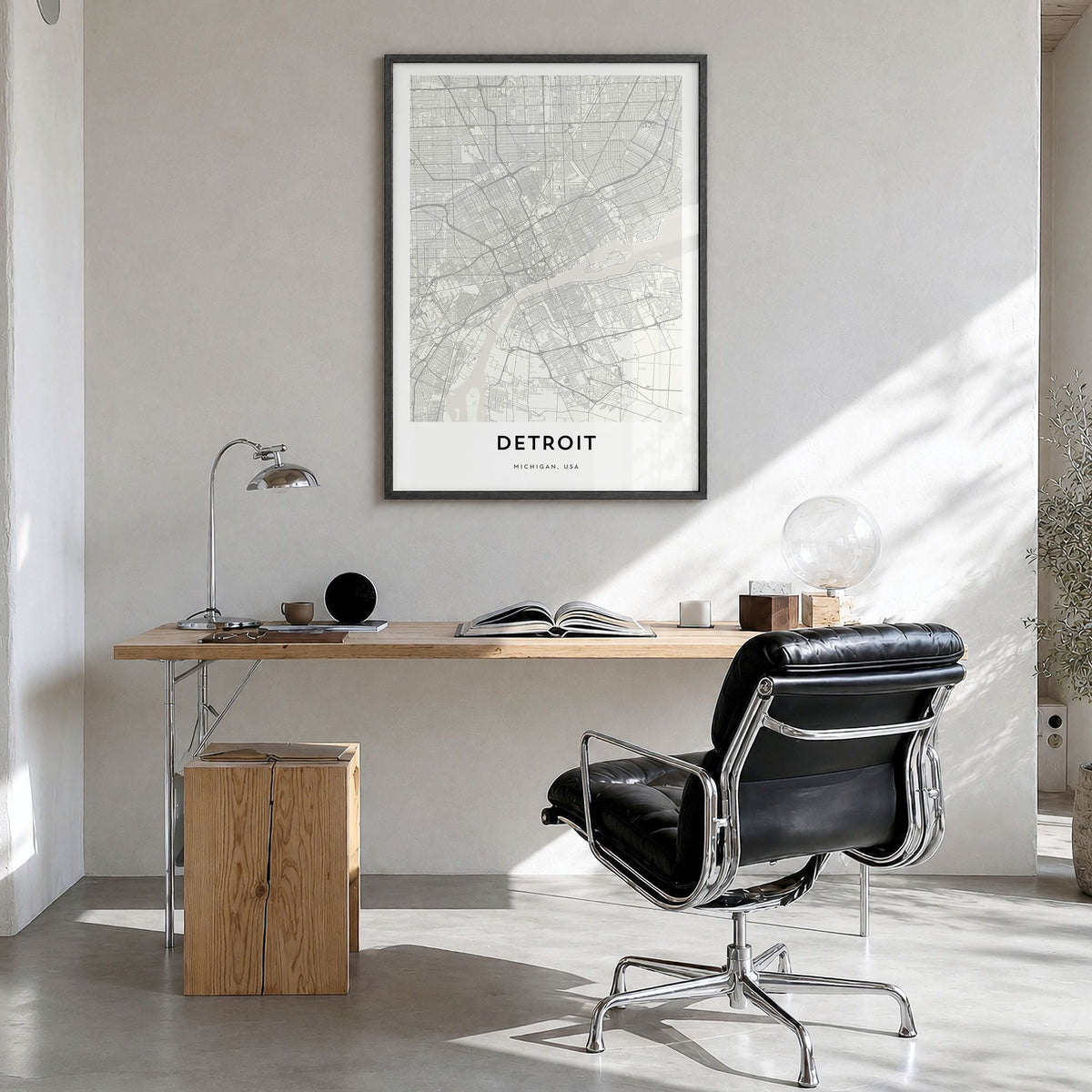 Detroit Map Poster in a black wood frame, hanging in a bright home office