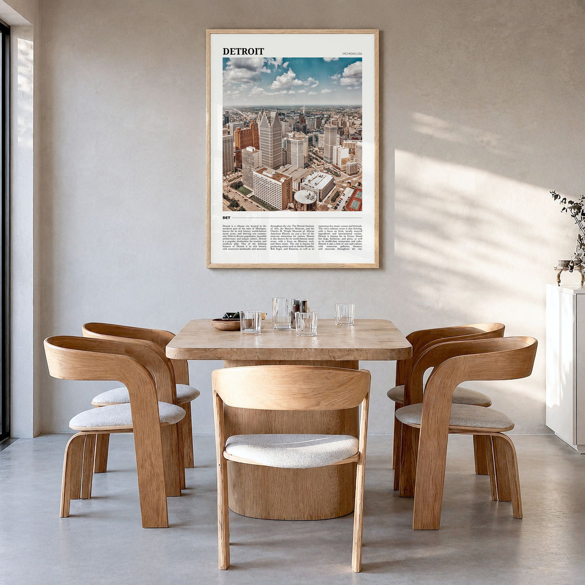 Detroit Travel Poster in a natural wood frame, hanging in a dining room