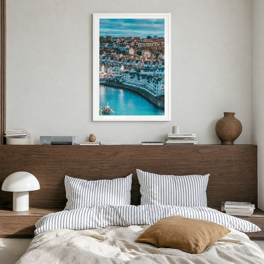 Devon Photo Poster in a white wood frame, hanging in a bedroom, white border