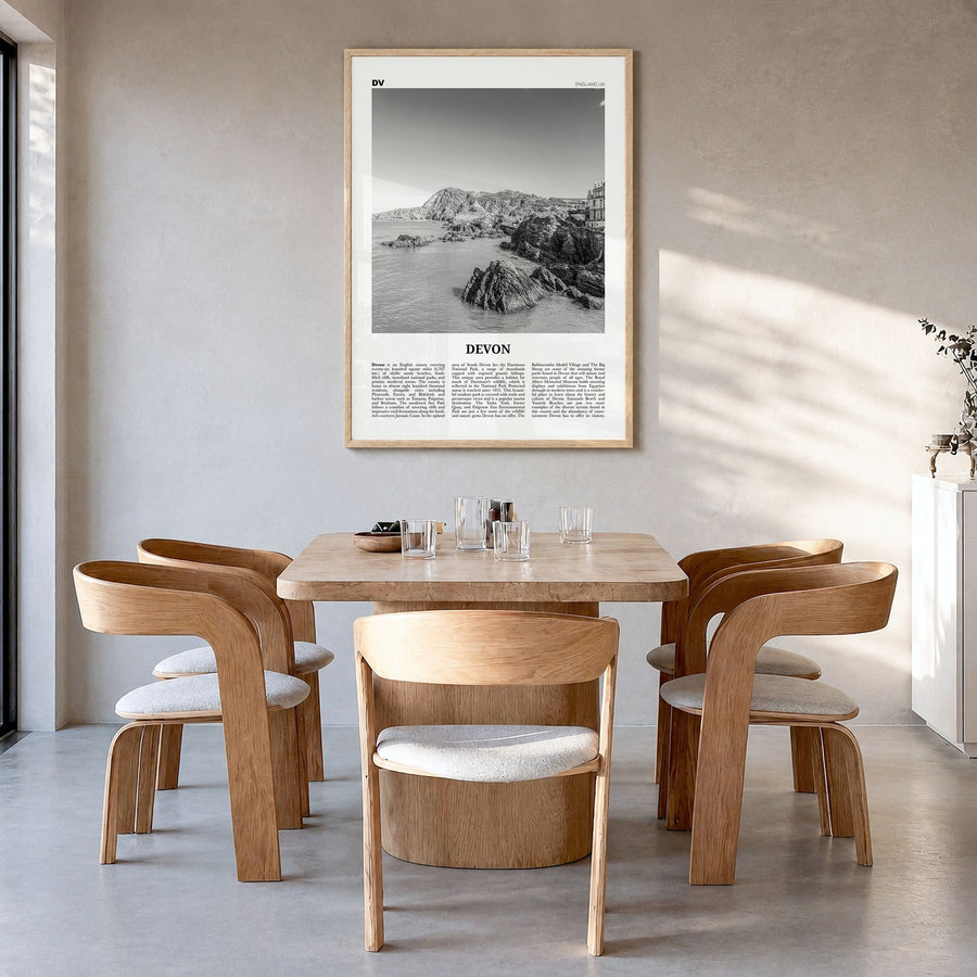 Devon Newspaper Poster in a natural wood frame, hanging in a dining room