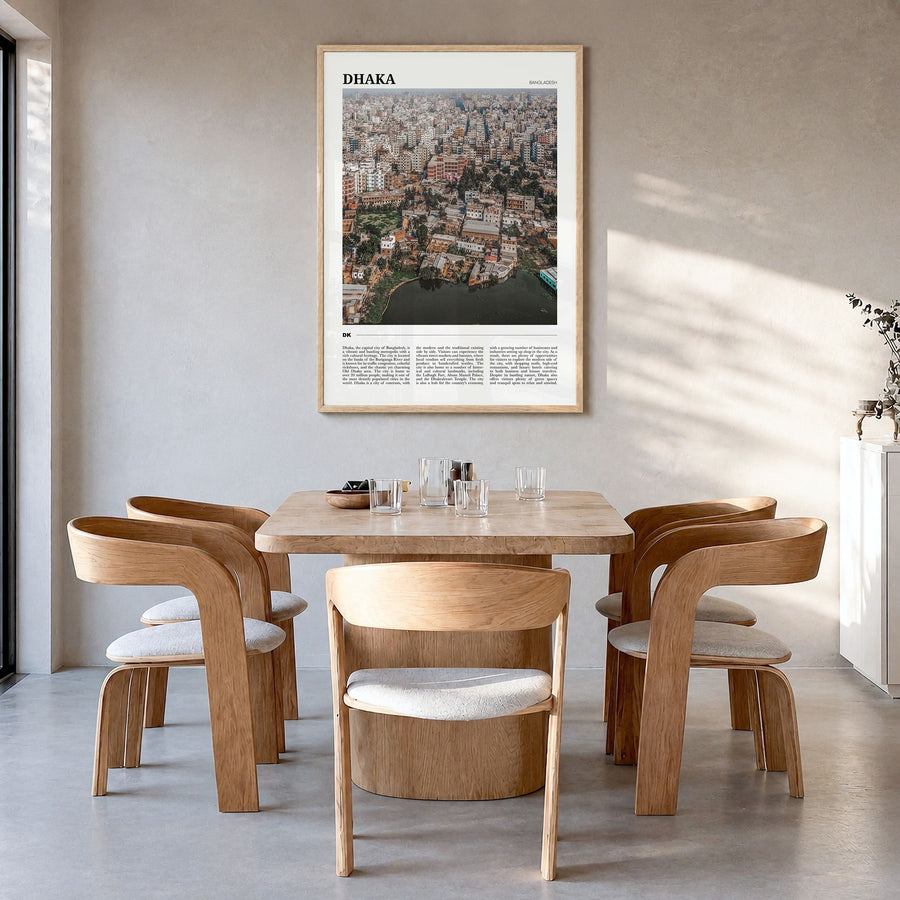 Dhaka Travel Poster in a natural wood frame, hanging in a dining room