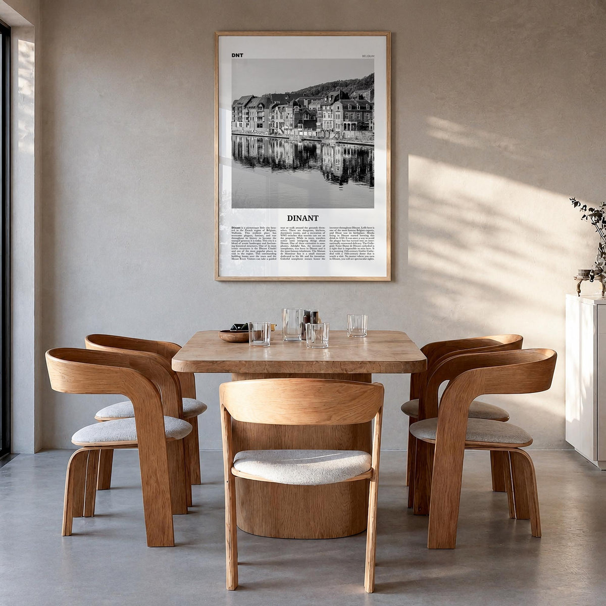 Dinant black & white newspaper poster of Belgium – vertical wall art in natural wood frame, hanging on wall