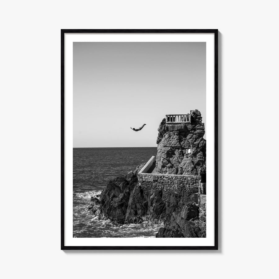 Diving black & white photo poster – vertical wall art, unframed print shown in interior mockup