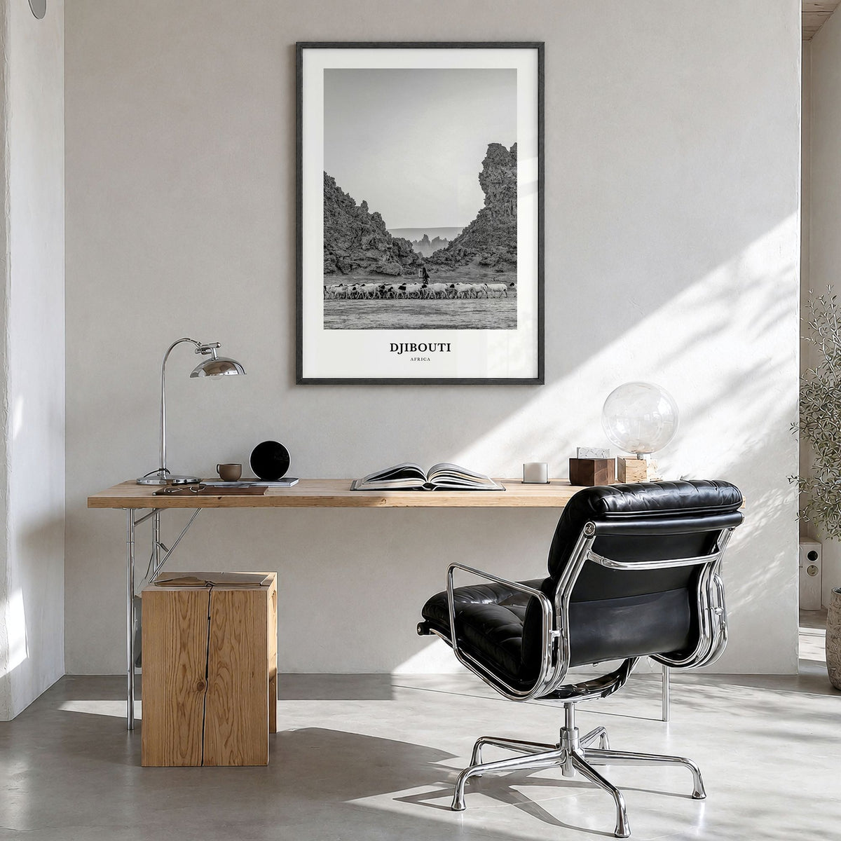 Djibouti Classic Poster in a black wood frame, hanging in a bright home office