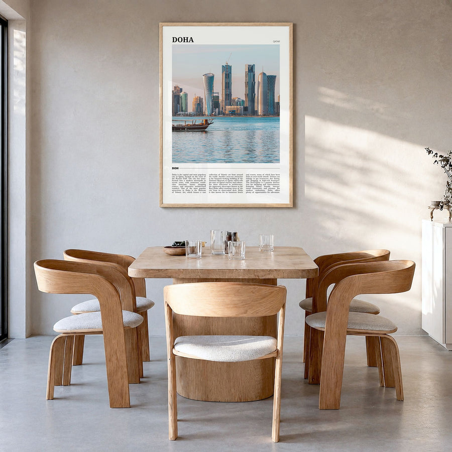 Doha Travel Poster in a natural wood frame, hanging in a dining room
