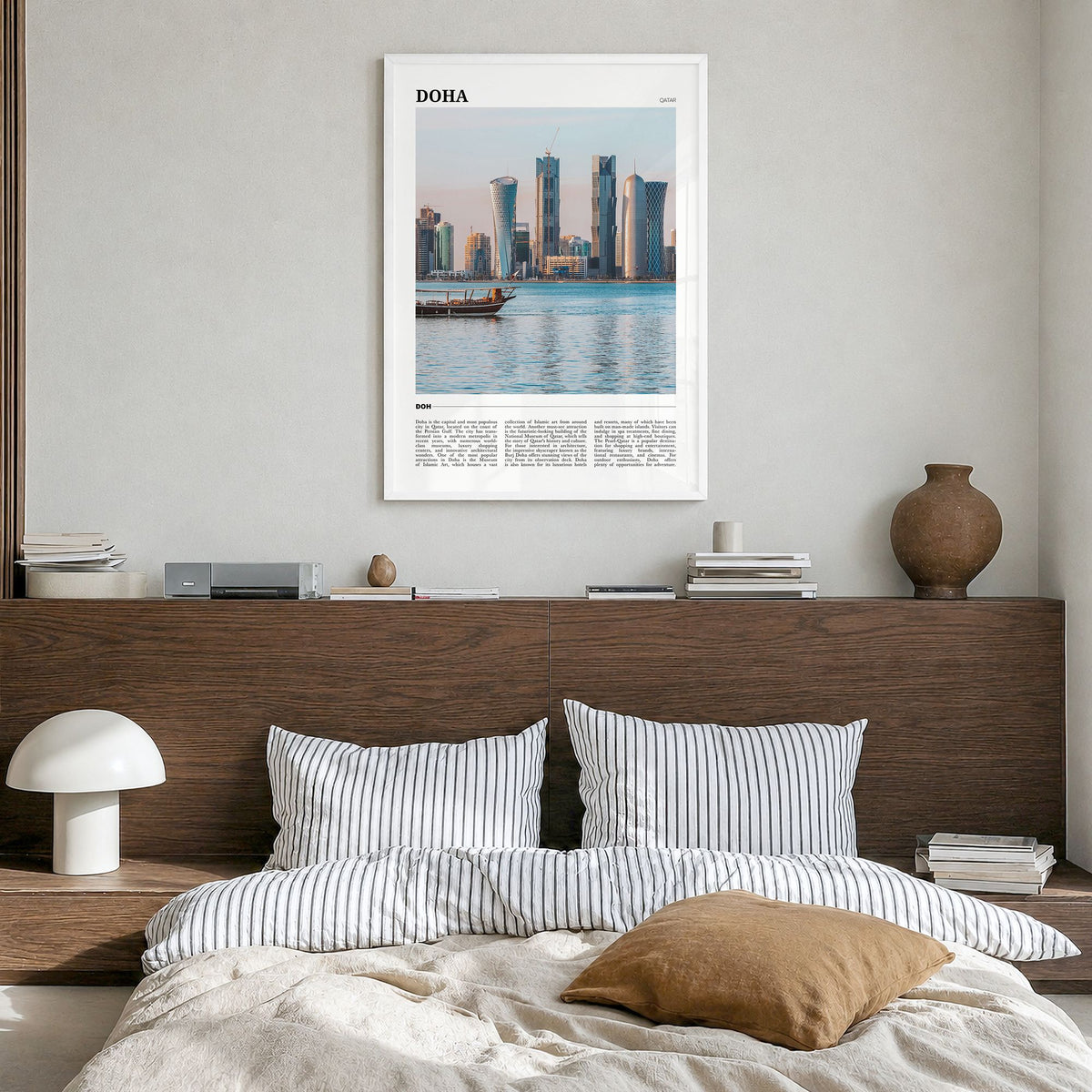 Doha Travel Poster in a white wood frame, hanging in a bedroom