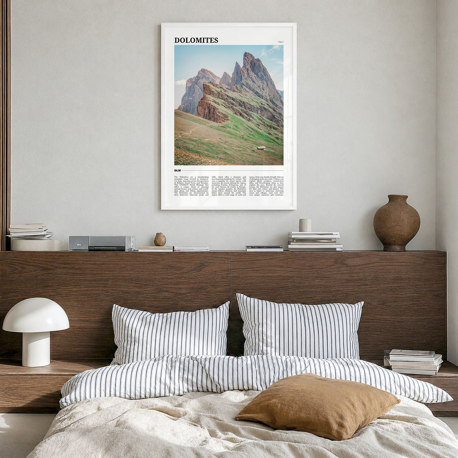 Dolomites Travel Poster in a white wood frame, hanging in a bedroom