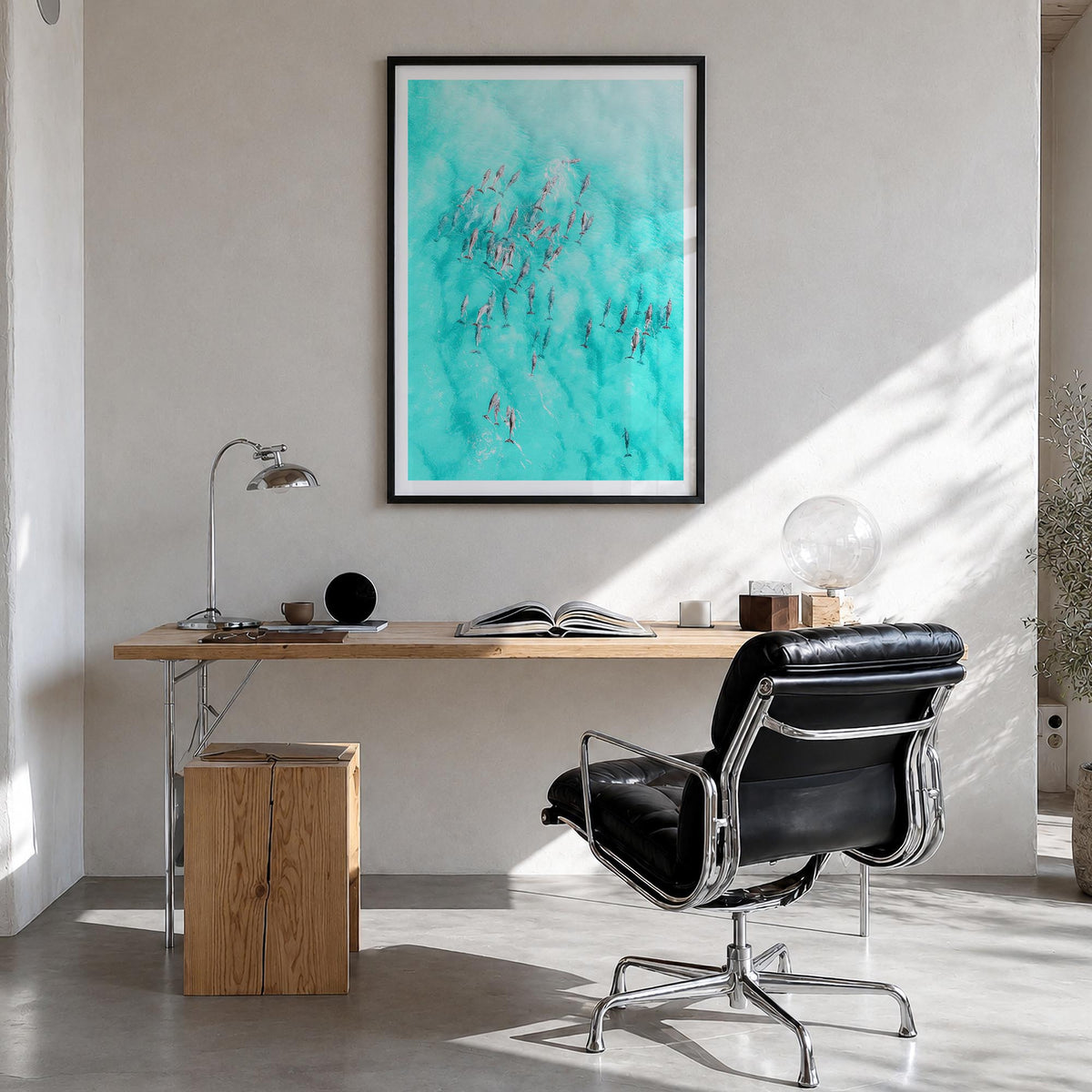 Dolphin Swimming colorful photo poster – vertical wall art in black wood frame with white border, hanging on wall