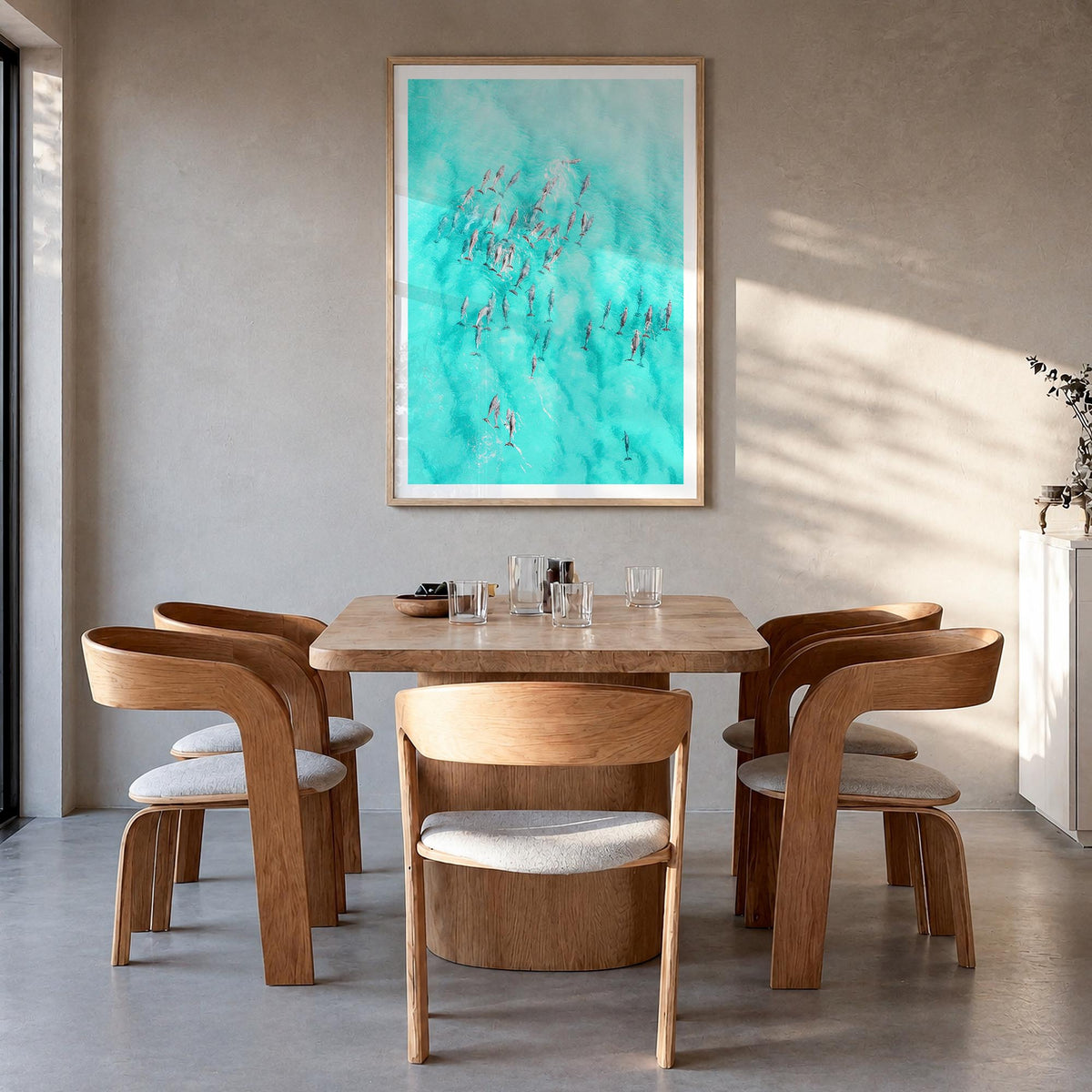 Dolphin Swimming colorful photo poster – vertical wall art in natural wood frame with white border, hanging on wall