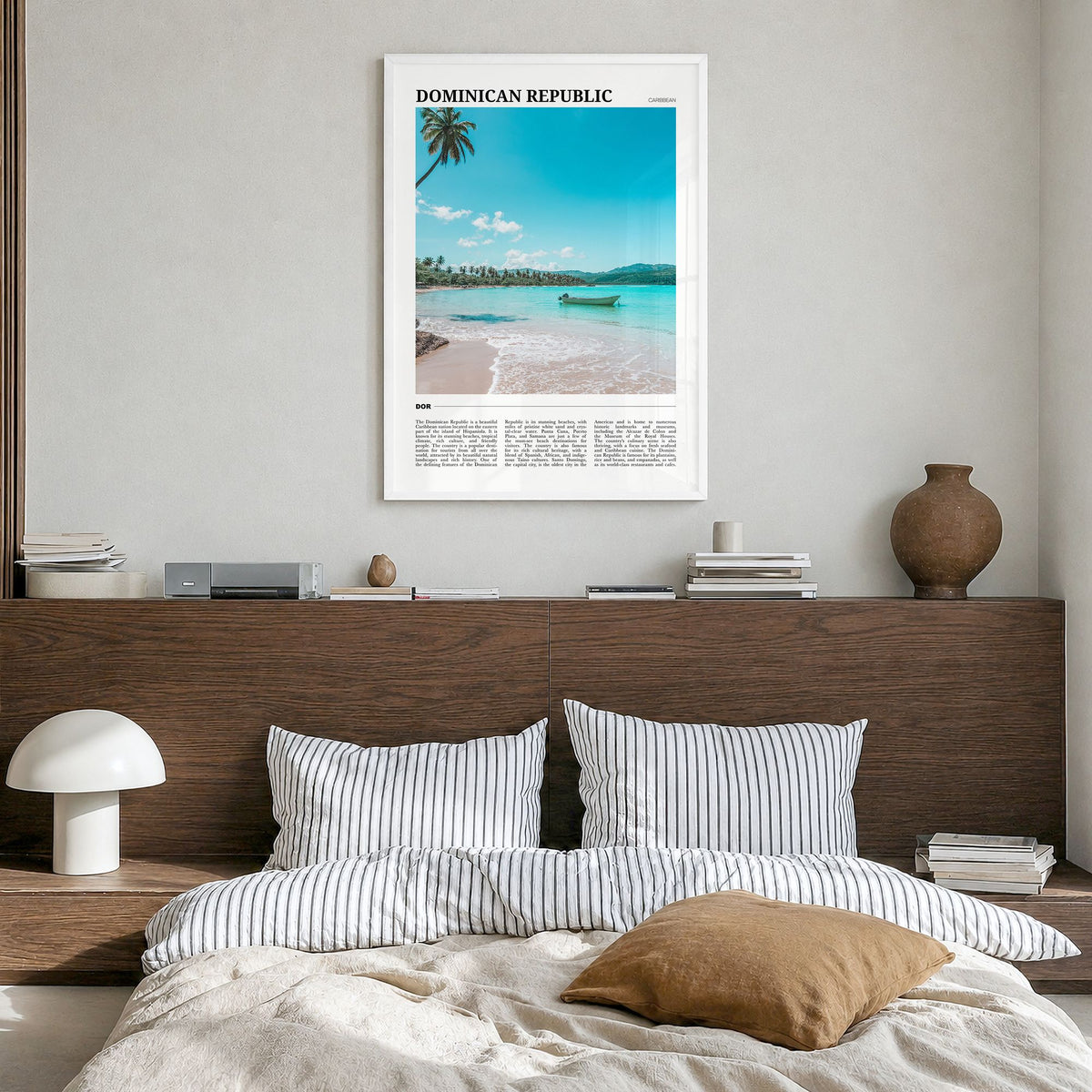 Dominican Republic Travel Poster in a white wood frame, hanging in a bedroom