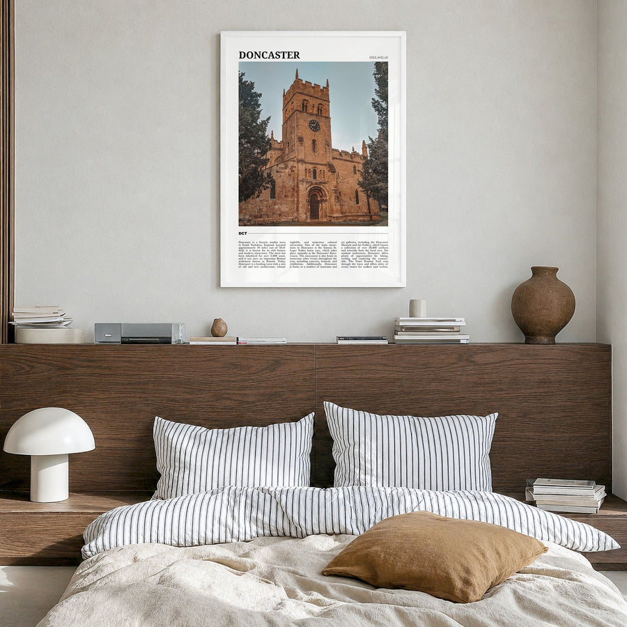 Doncaster Travel Poster in a white wood frame, hanging in a bedroom