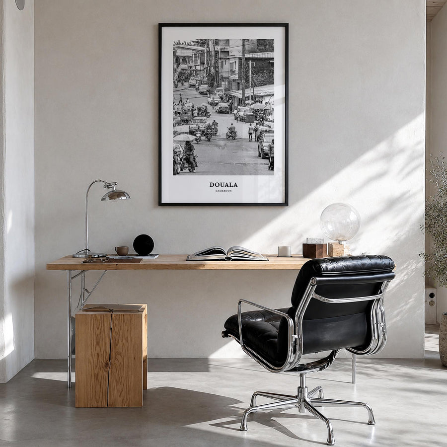Douala black & white classic poster of Cameroon – vertical wall art in black wood frame, hanging on wall